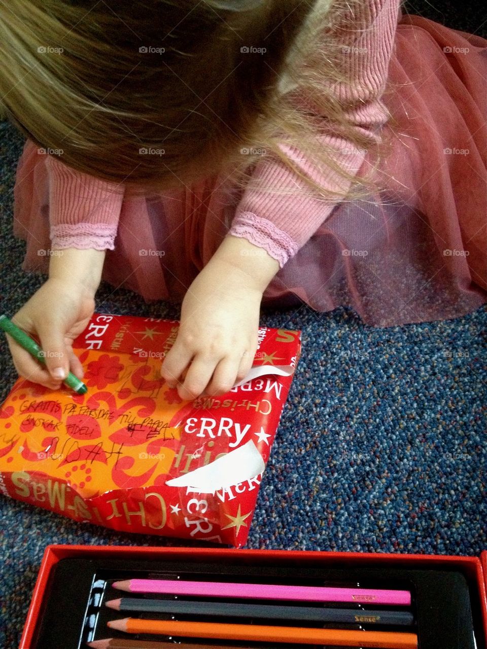 Girl Wrapping a christmaspresent