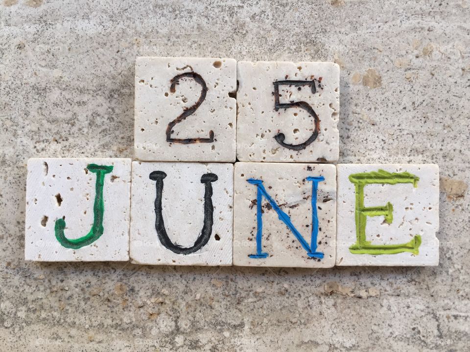 25th June, calendar date. Composition with travertine carved pieces of 25th June, calendar date