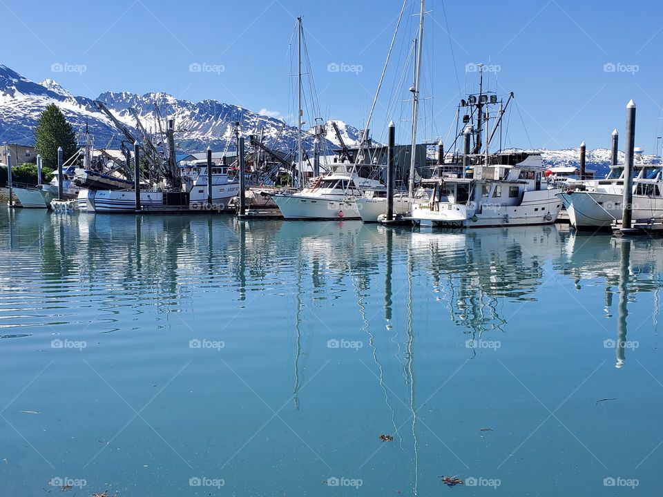The fishing boat docks in Valdez, Alaska. the water is so blue because it is glacier water.