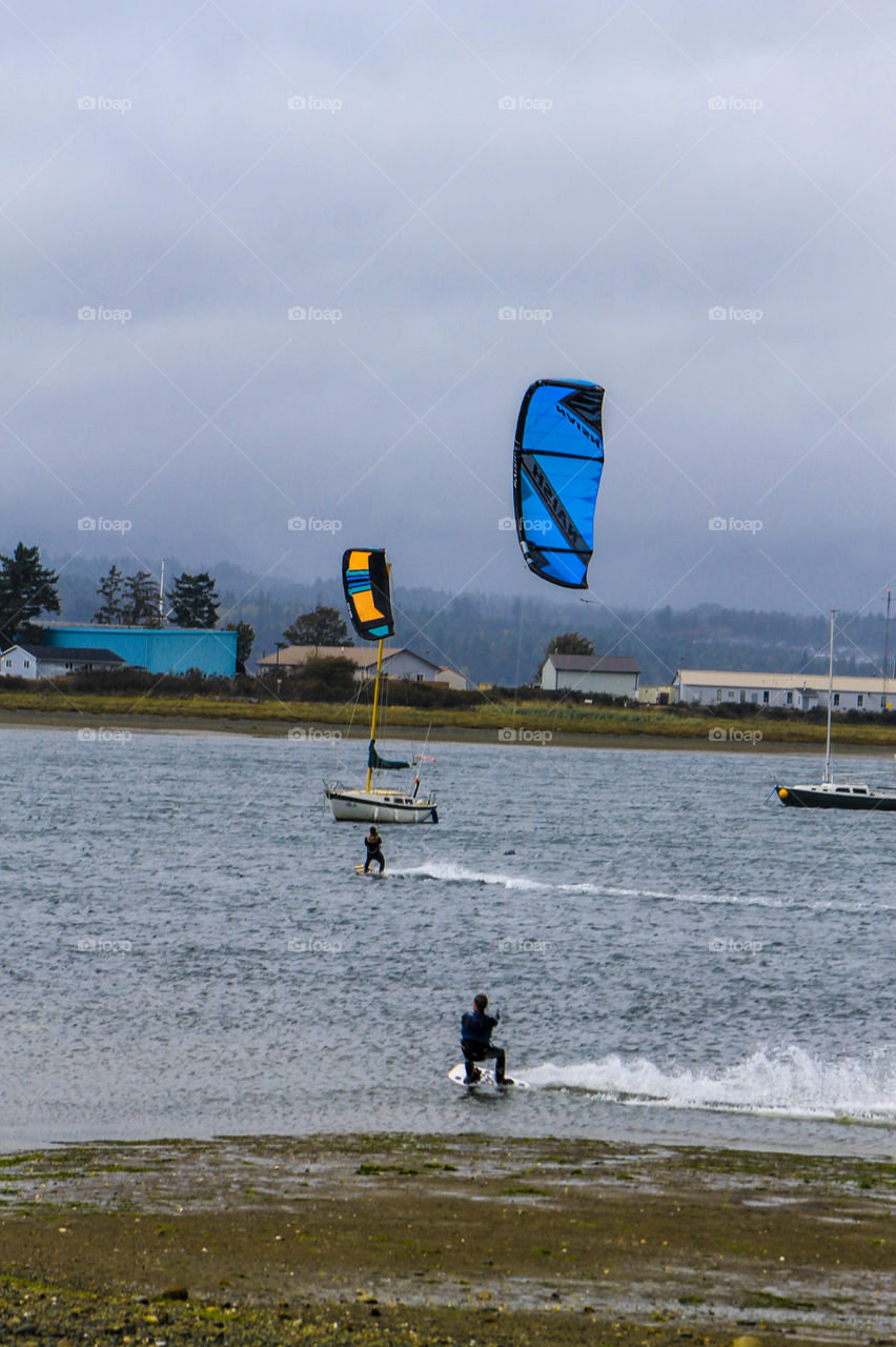 It is almost always windy on the Canadian Pacific Coast. This makes it perfect for sailers & when there’s even more wind/kite surf boarders! These boarders are whipping along the estuary Now that’s a great way to get from Point A to B!