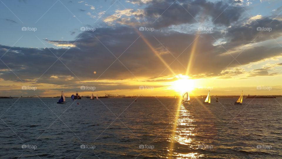 Bright sunset over sailboats
