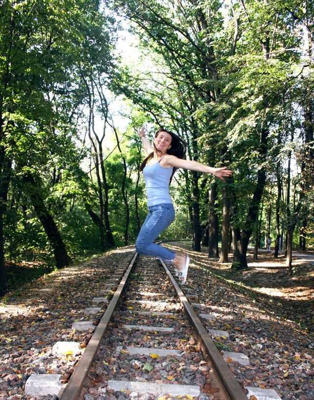 Happy girl. Railway for children in the park