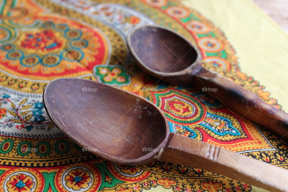 Wooden spoons on traditional towel