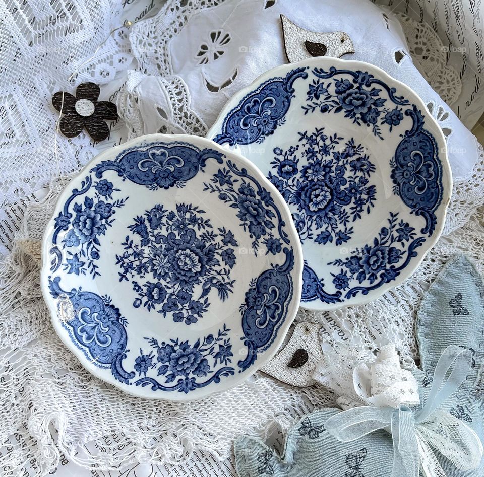 Old porcelain dinner plates with blue pattern 