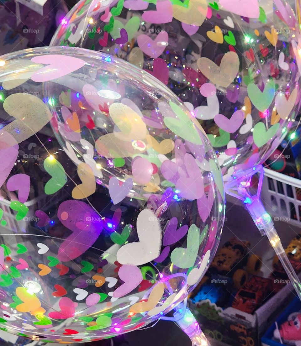 whimsical children's heart pattern balloon toy in barbie style pink and purple colors at an Oregon fair