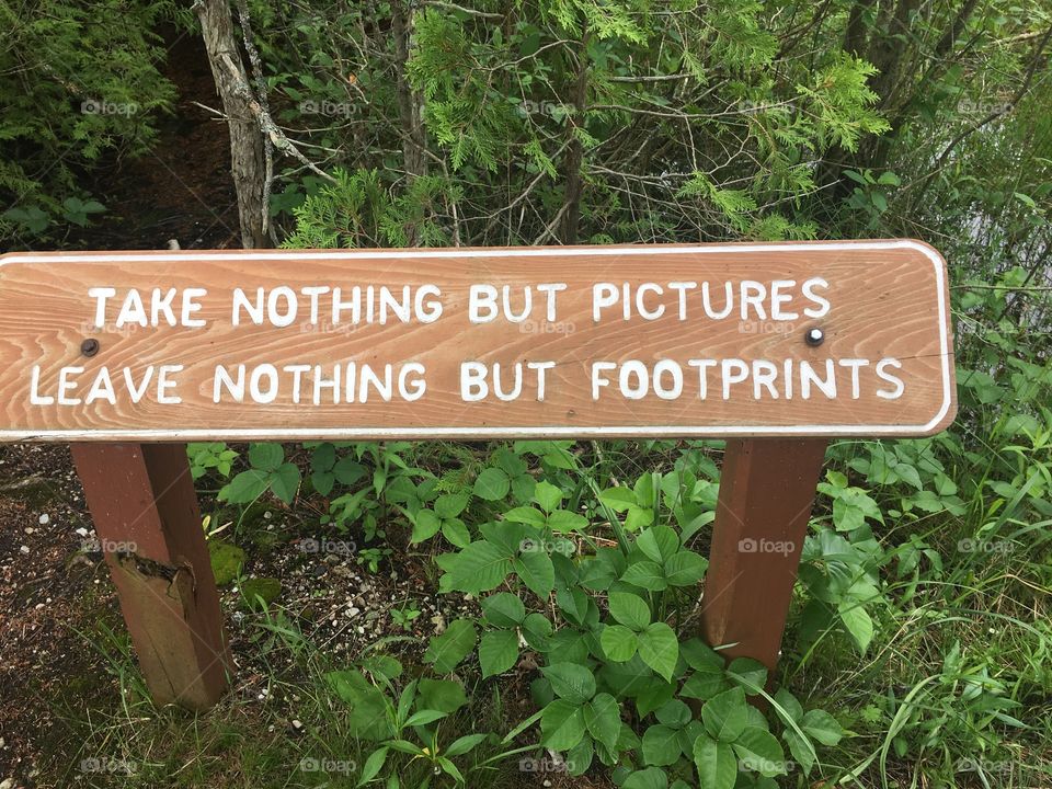 A meaningful sign found on a nature trail somewhere on Mackinac Island, Michigan.