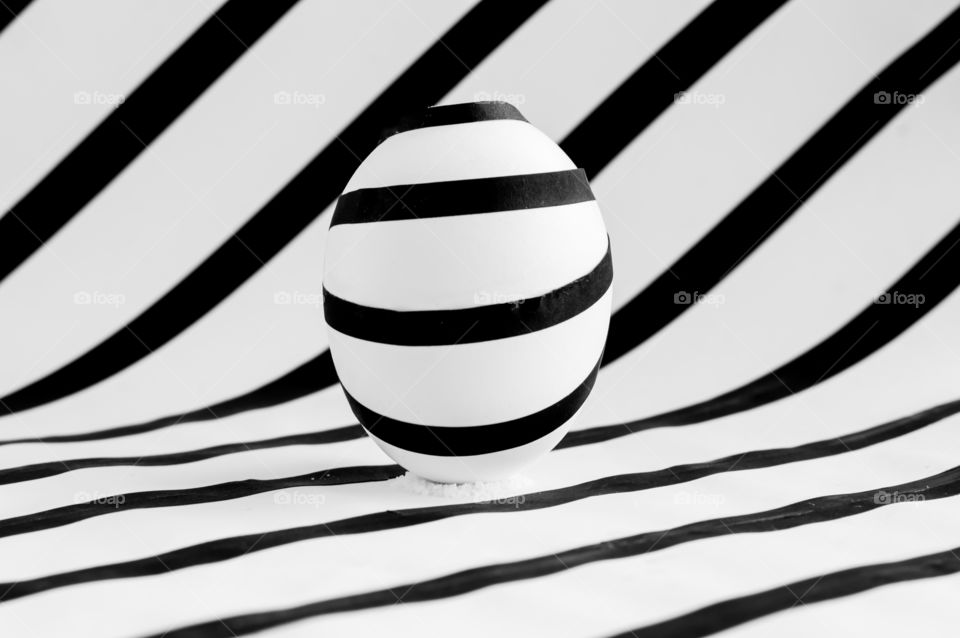Egg in black and white stripes.