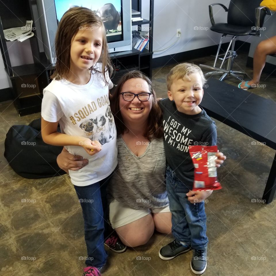 Portrait of a mother with her children in house