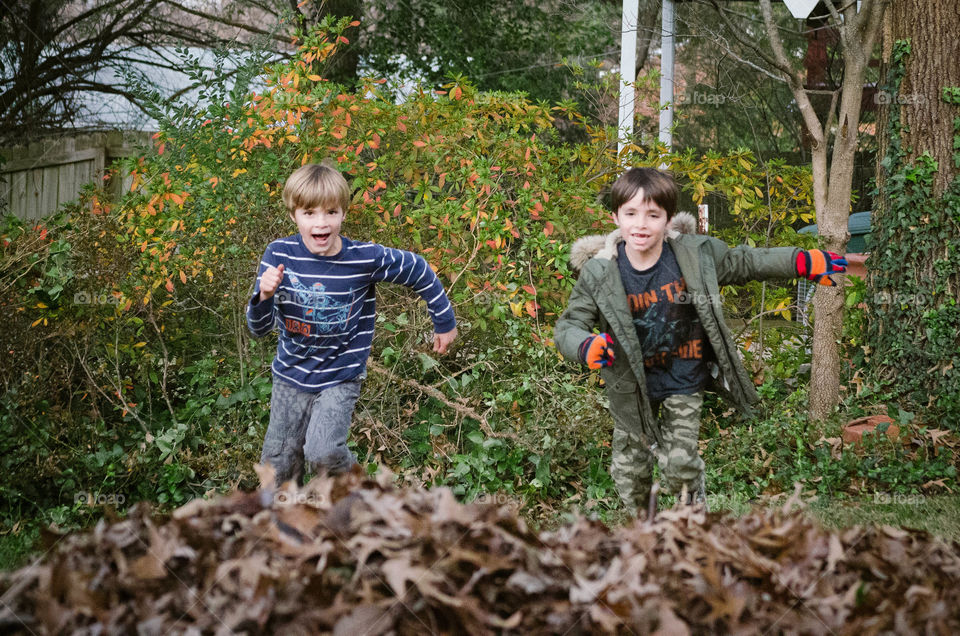 Jumping in the leaves. It's autumn