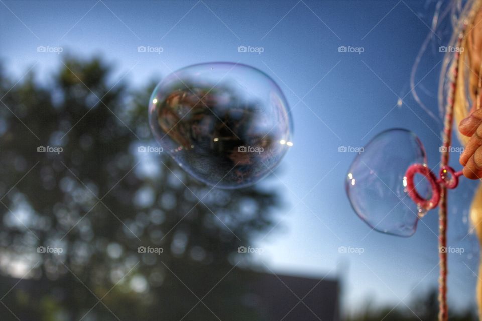 Bubbles. A child playing with bubbles