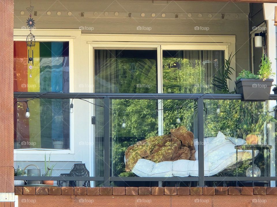 Pride rainbow in Oregon apartment window