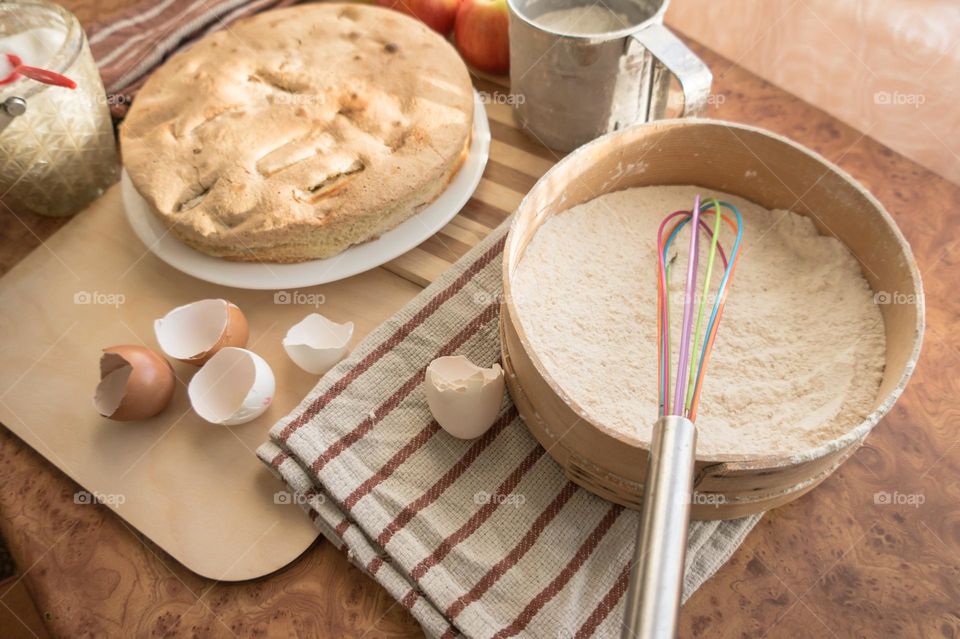 Making homemade puffed apple pie with eggs, sugar and flour.