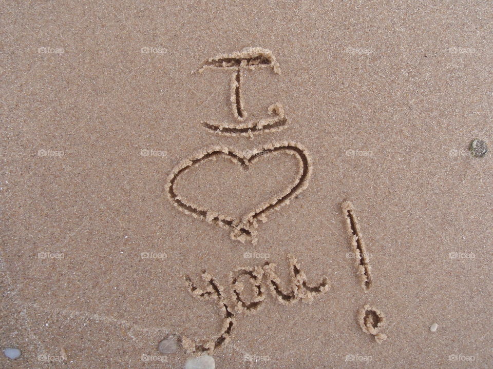 I <heart> You. I <heart> You message written in sand 