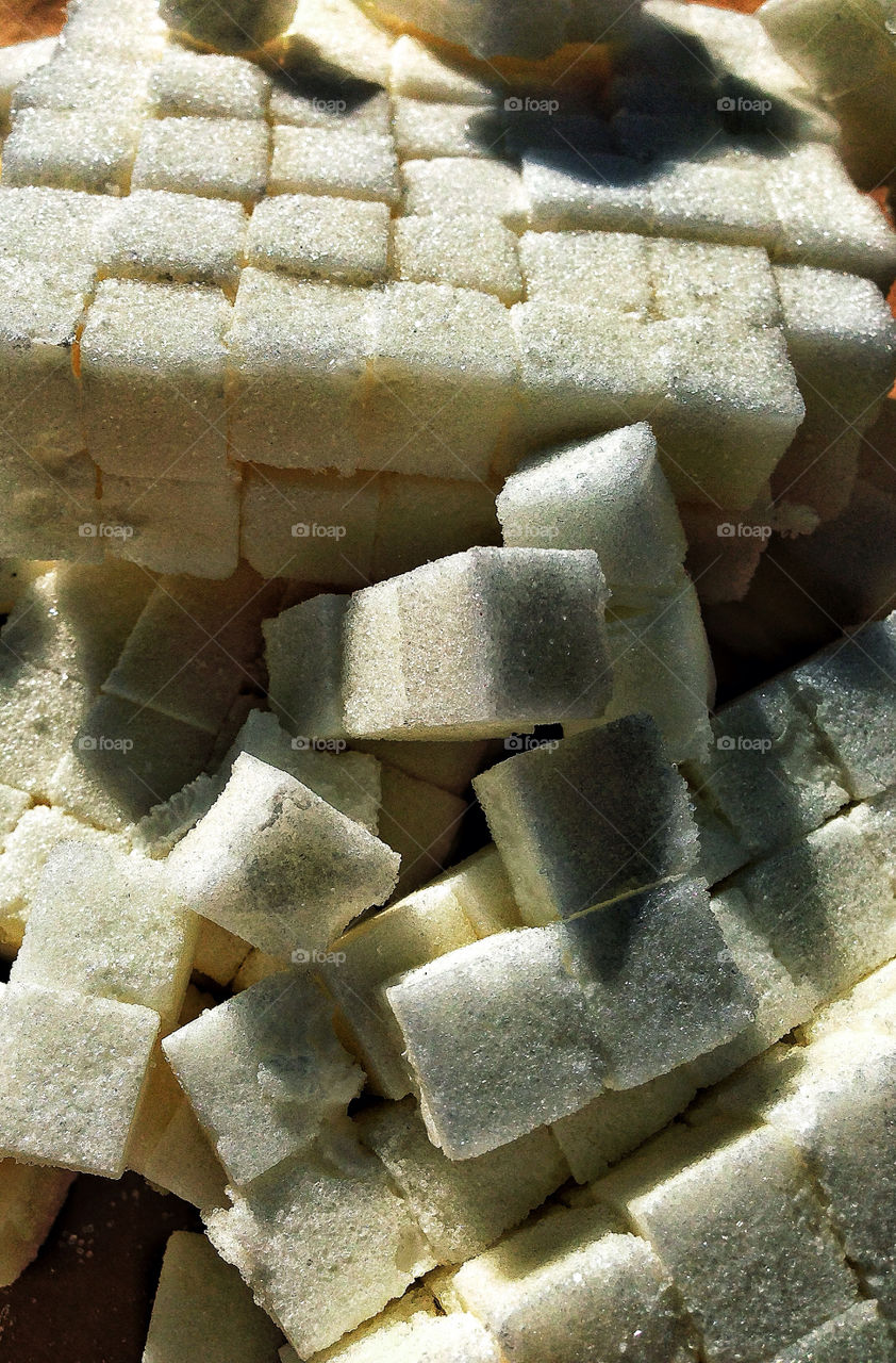 Bright white stacks of sugar cubes