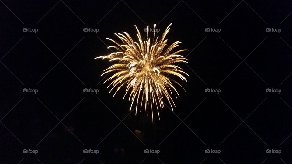 Firework display at night