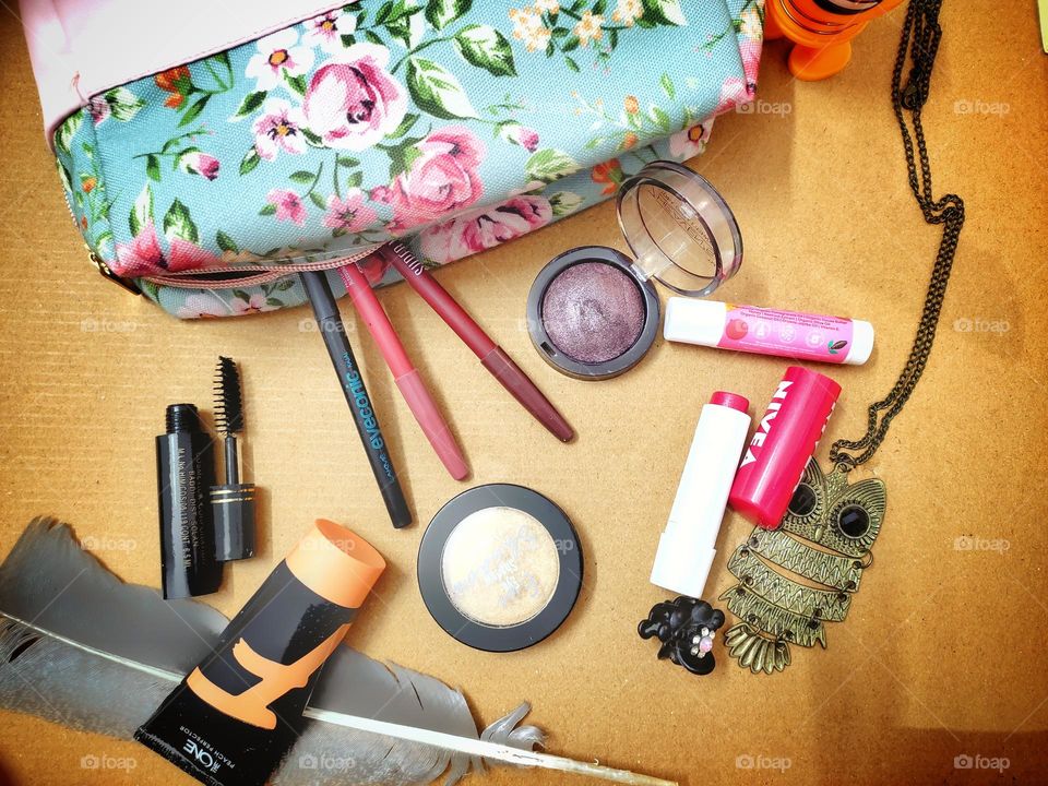 make-up pouch full of make-up products