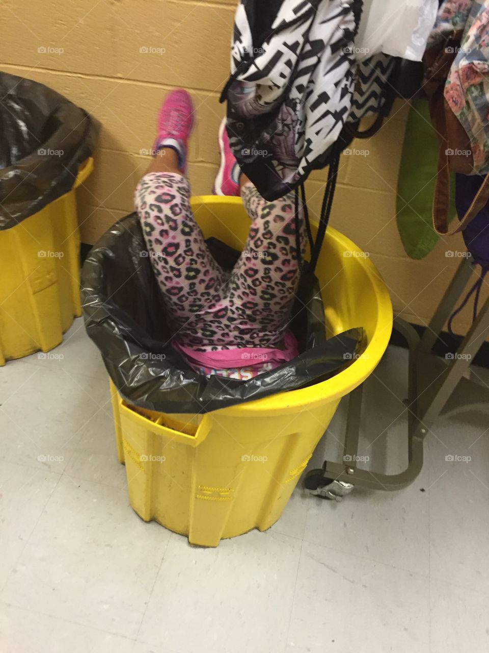 Kid in trashcan