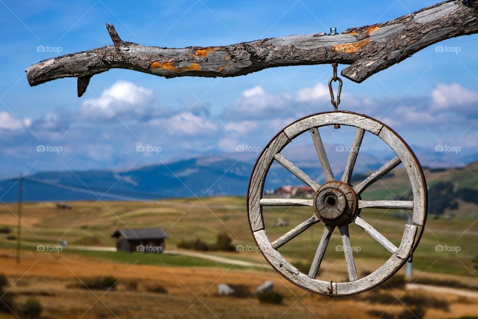 Wagon wheel outside a cafe in the mountains in South Tyrol