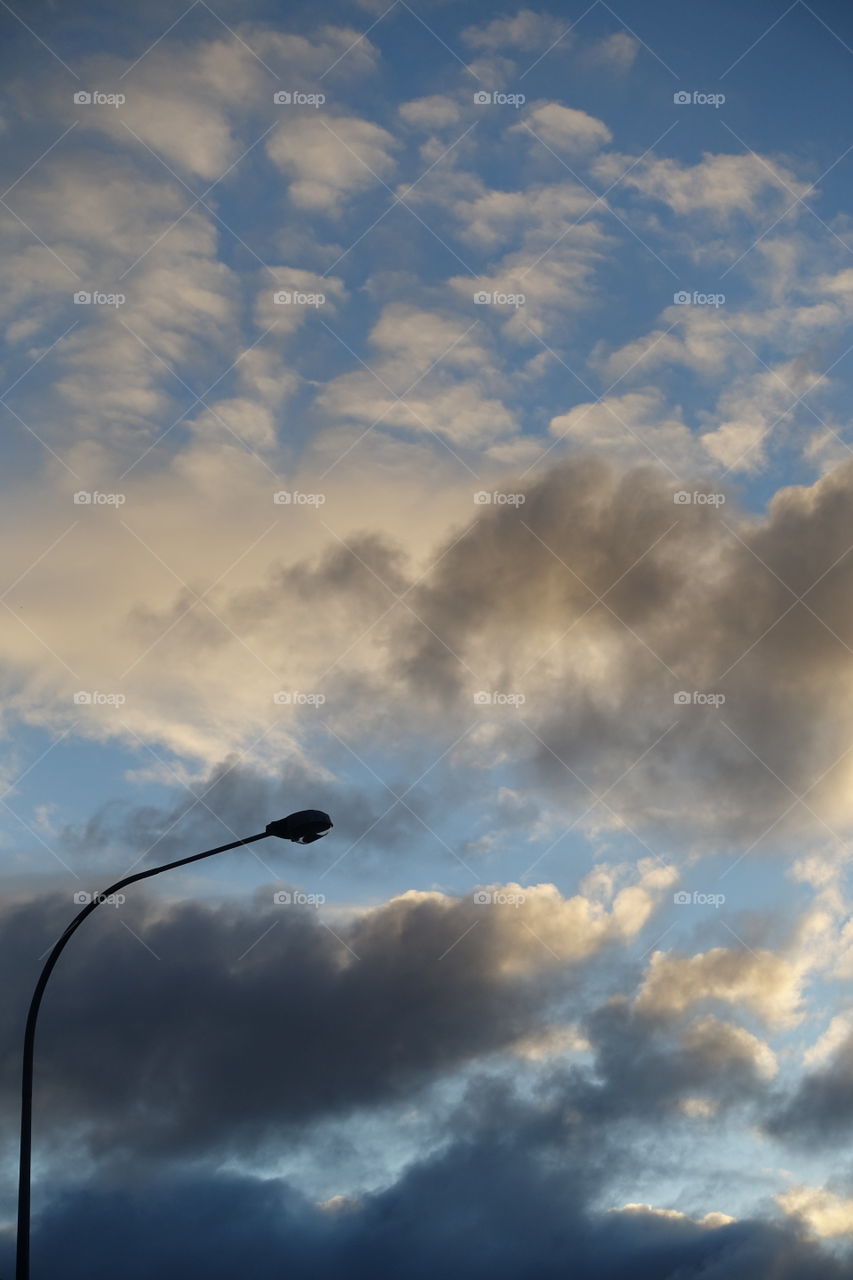 The evening sky shows interesting colour tone created by clouds and the light.