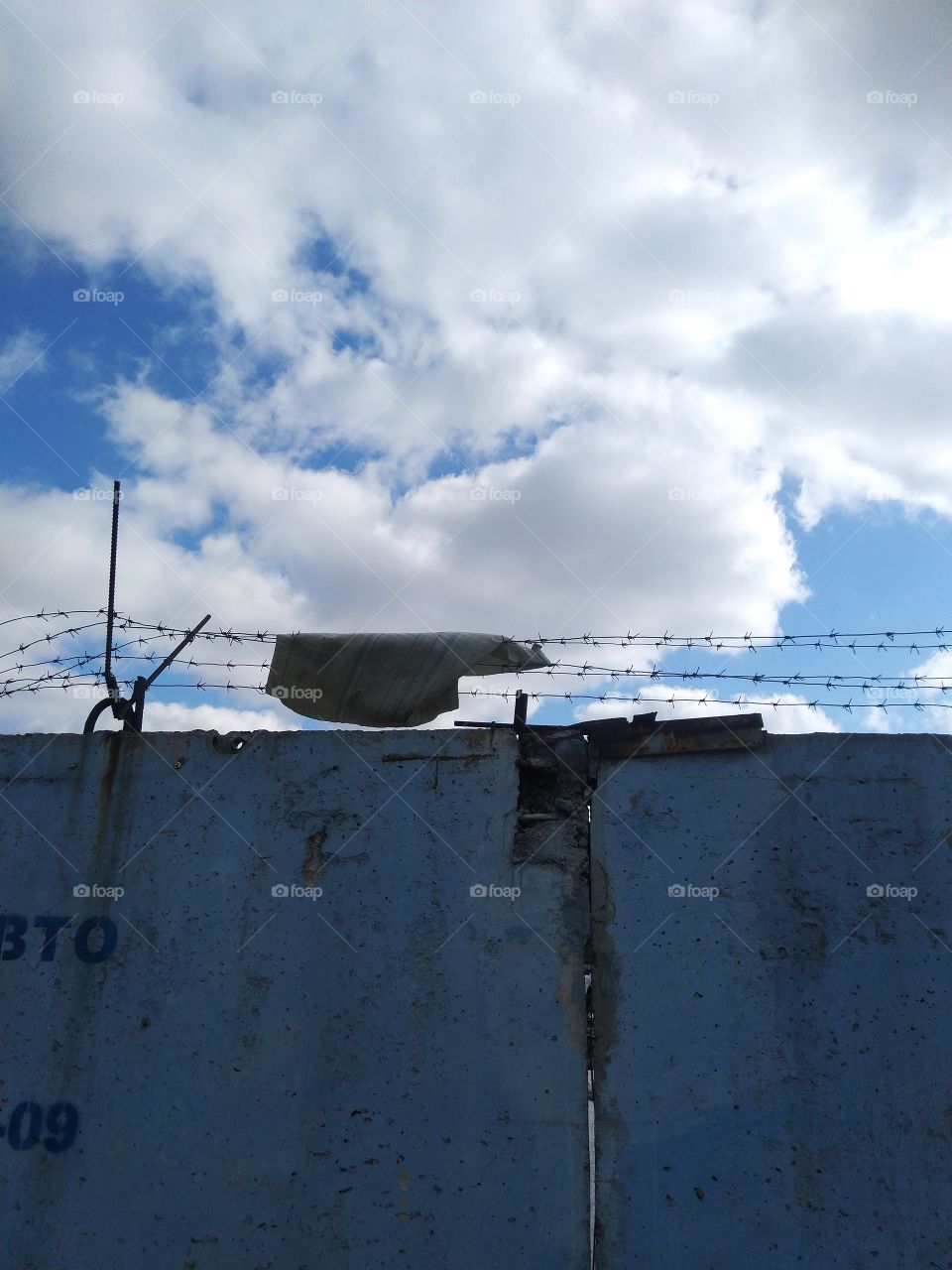 factory. wall. wire. blue.