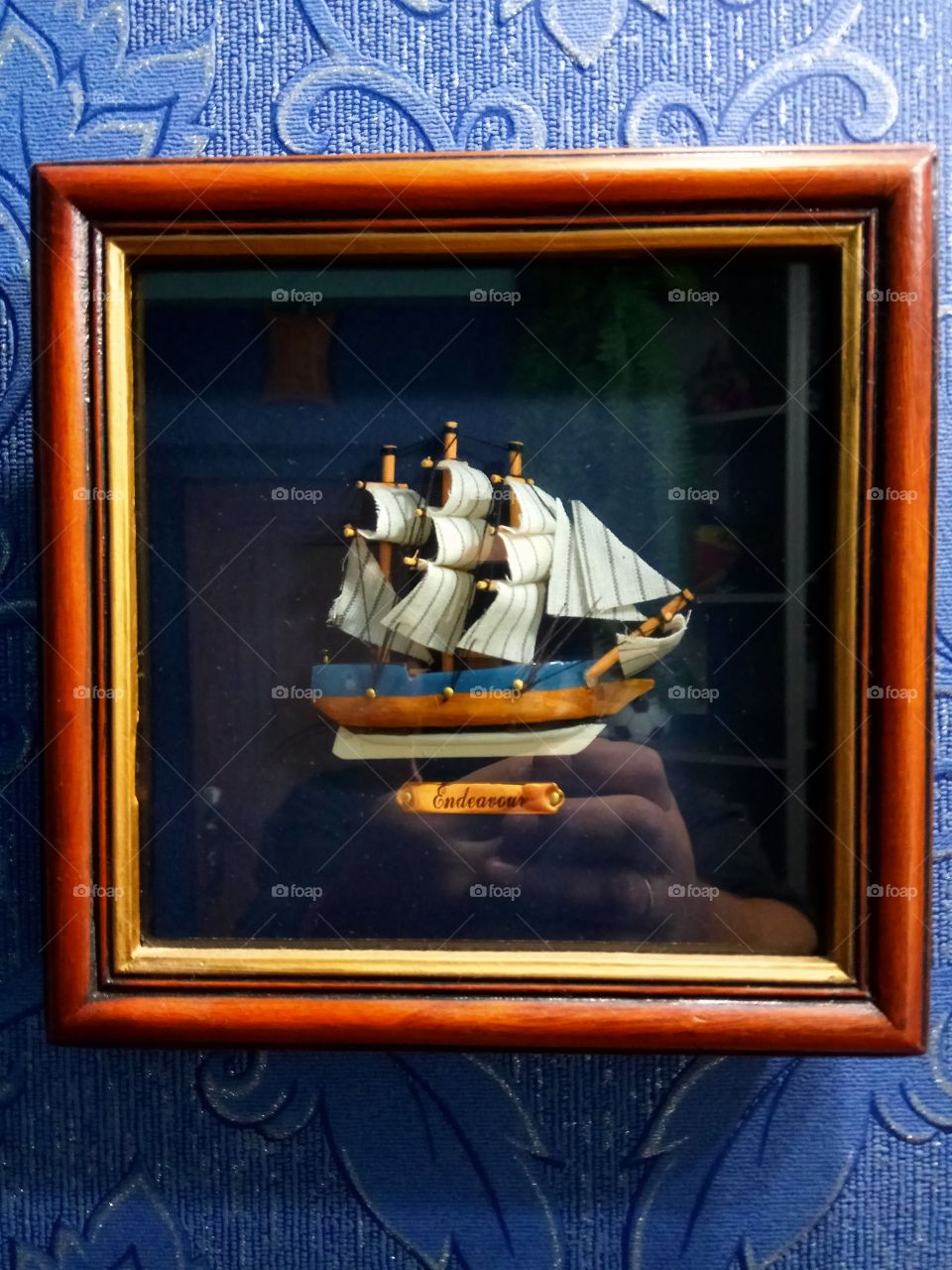 ship in a wooden frame container