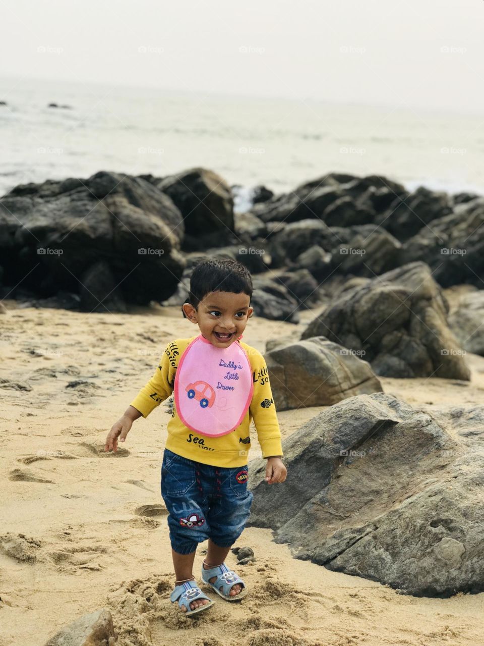 A kid enjoying a lot at beach in summer season.😍