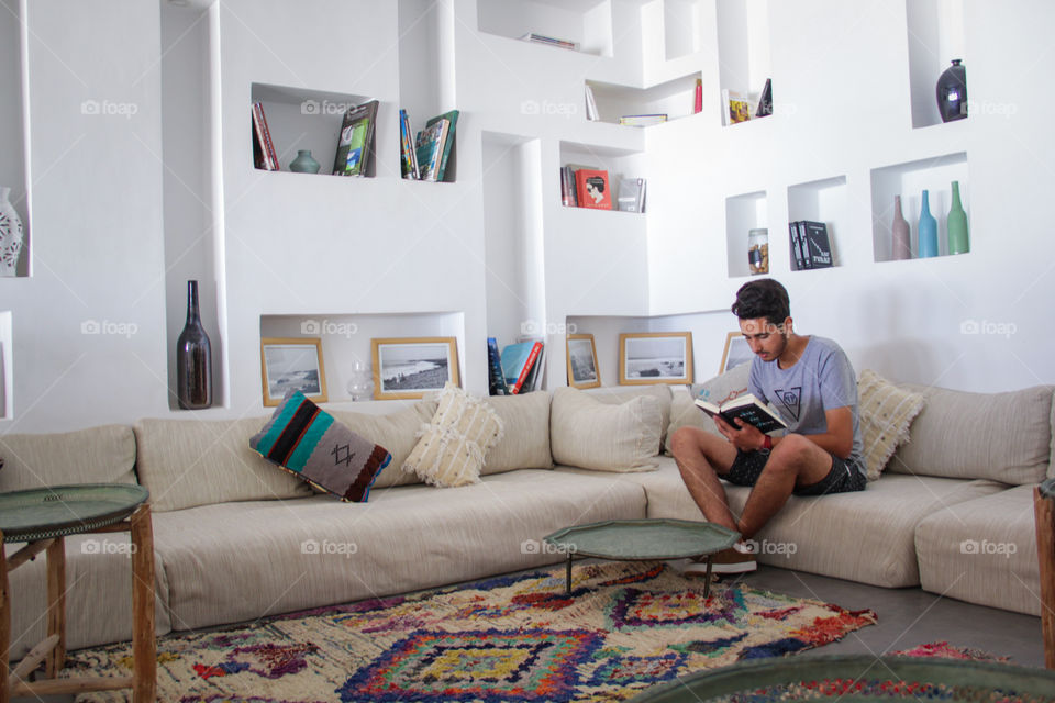 Young man reading indoor