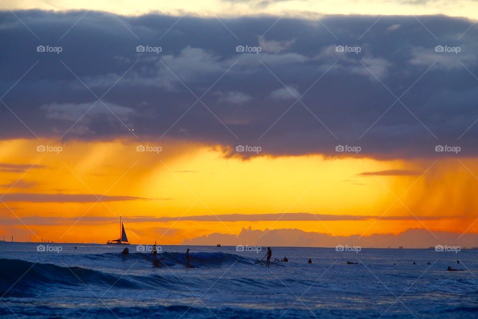 Surf, Sailboats and Sunset. Waikiki beach Oahu 