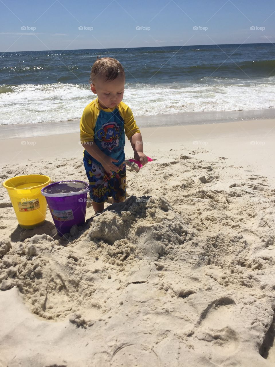 Boy playing on beach