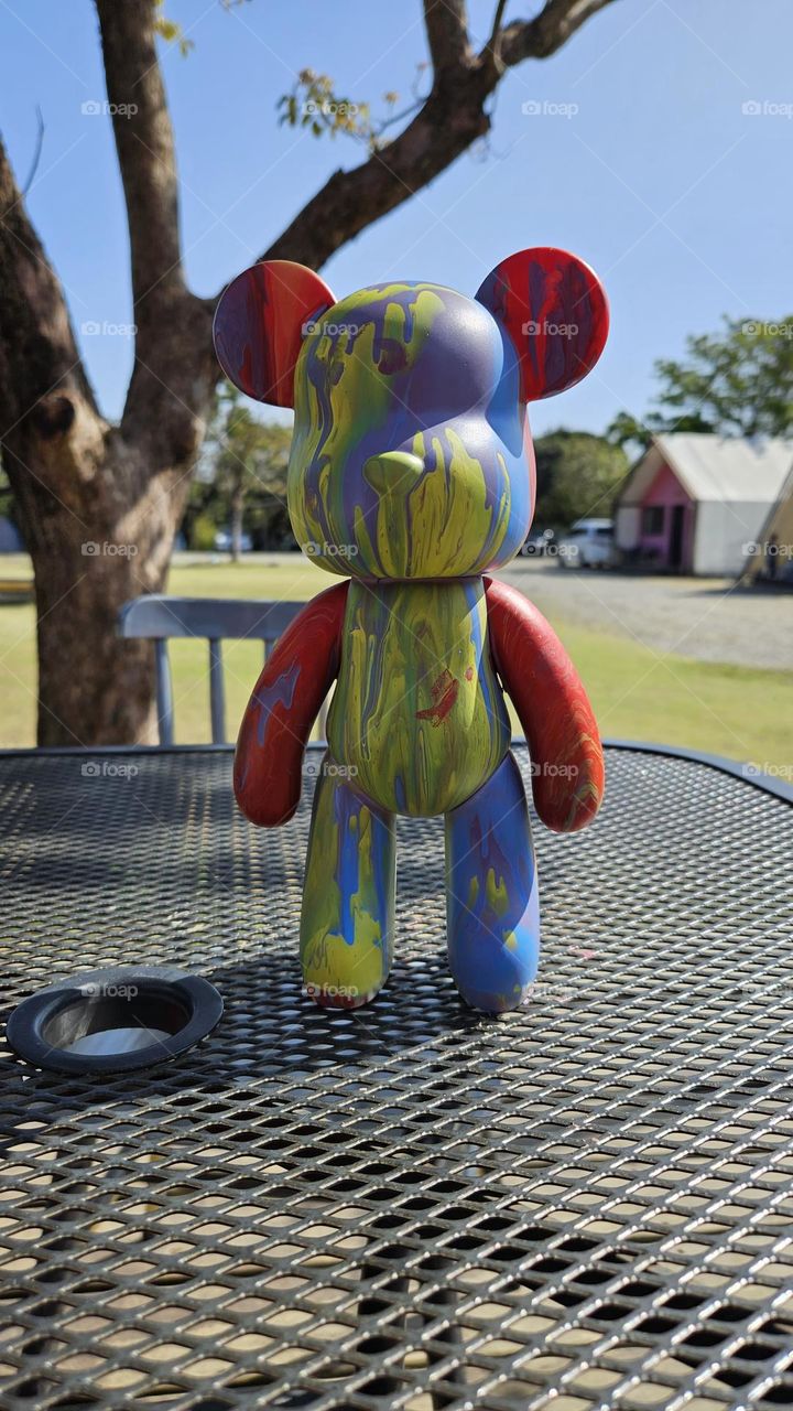 a pouring art toy bear