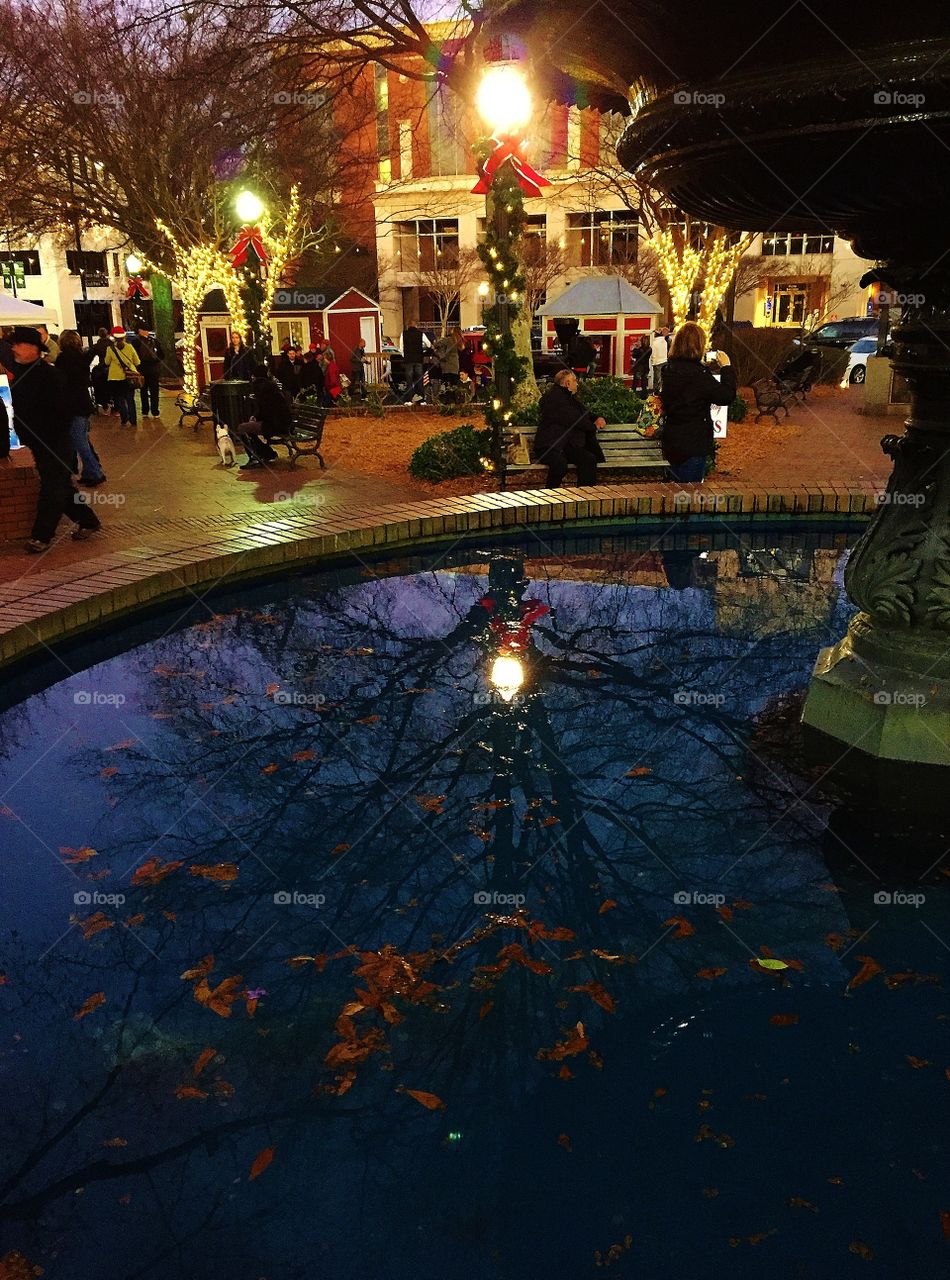 Reflections in a city fountain