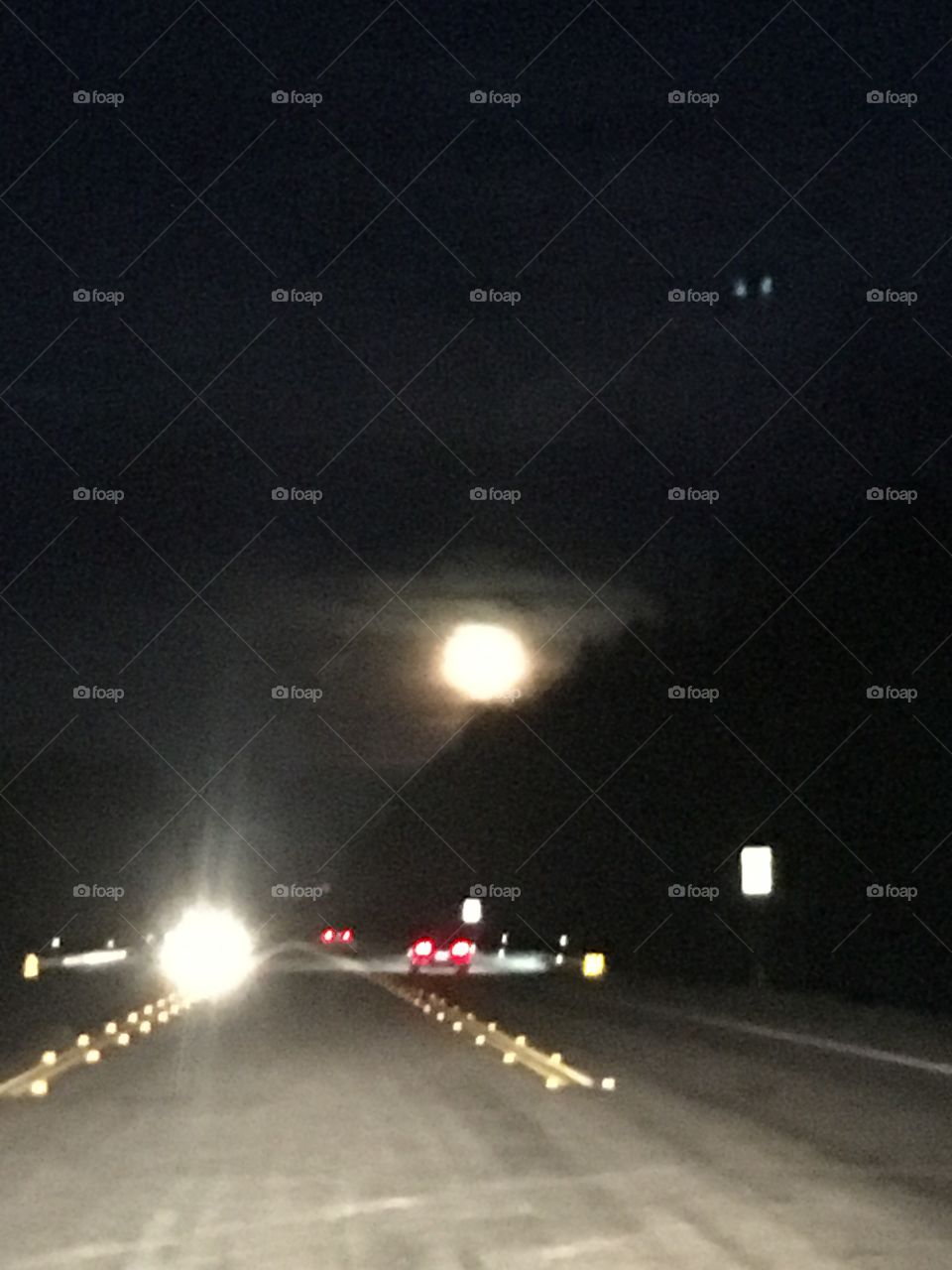 The moon at the end of the road