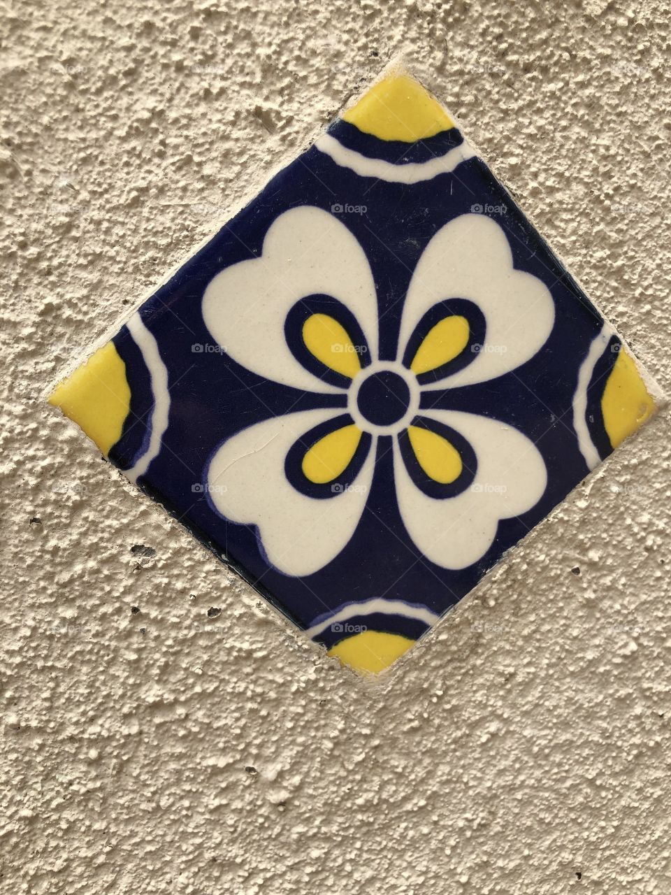 Tile in Stucco Wall