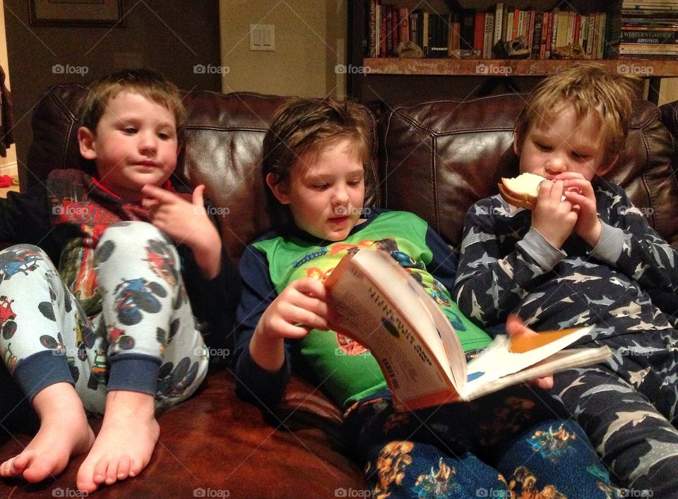 Young Brothers Reading Together