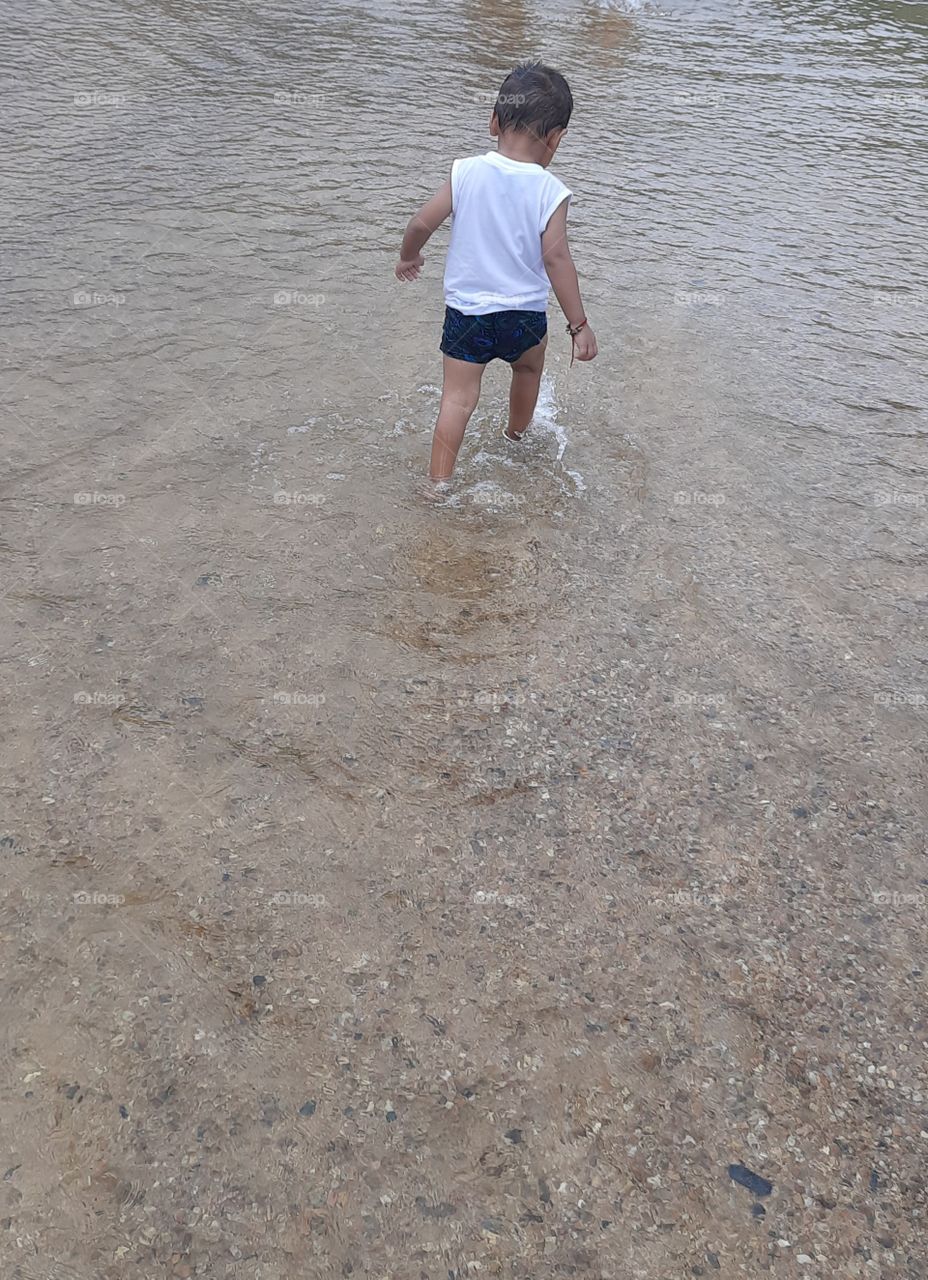 cute child in the rain water