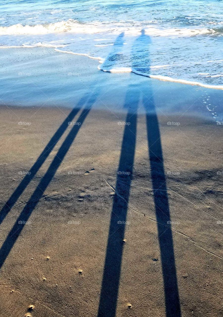 I'm not sure anyone would be interested in this picture but I've always thought shadow play was fun and makes for interesting pictures. These are outlines of my friends and I after a beach photoshoot as the Saturday, September sun was setting.