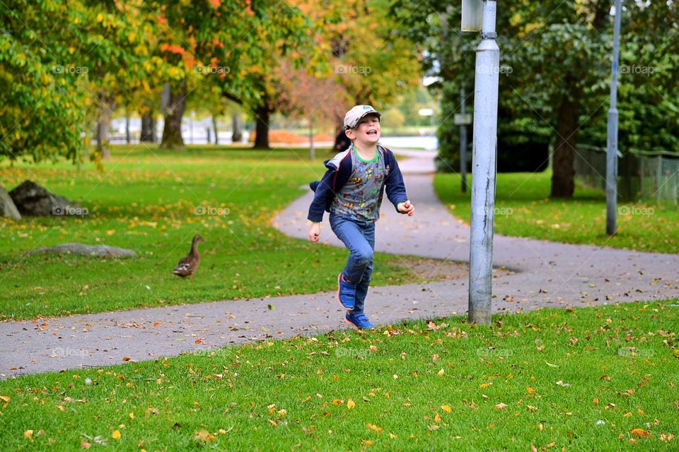 Boy running with a very happy face