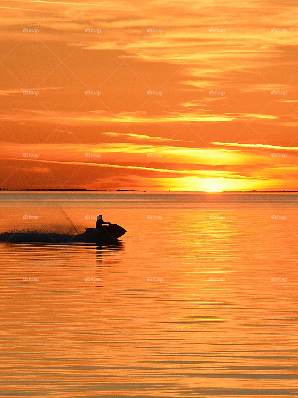 Skimming on the bay sunset 