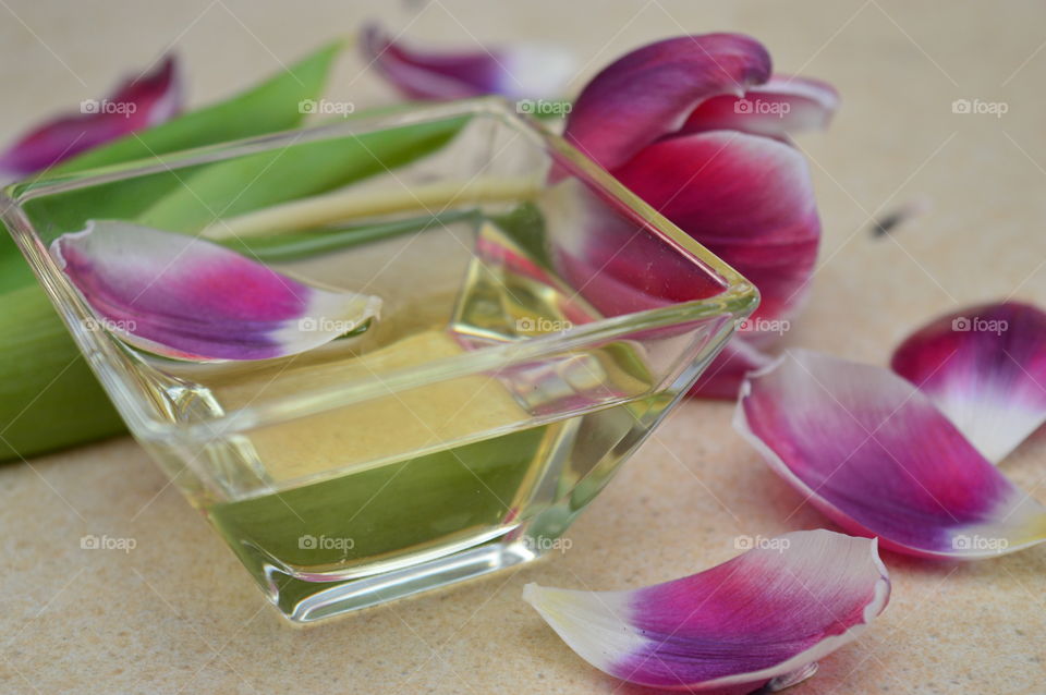 Oil in bowl with flower petal