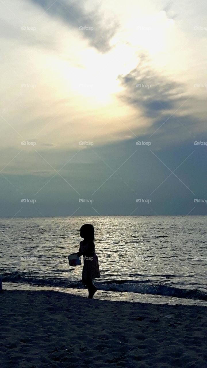 Girl playing on the beach