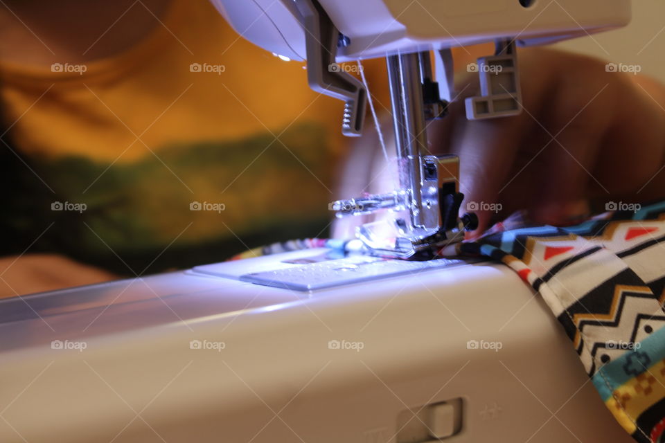 Woman working on sewing machine