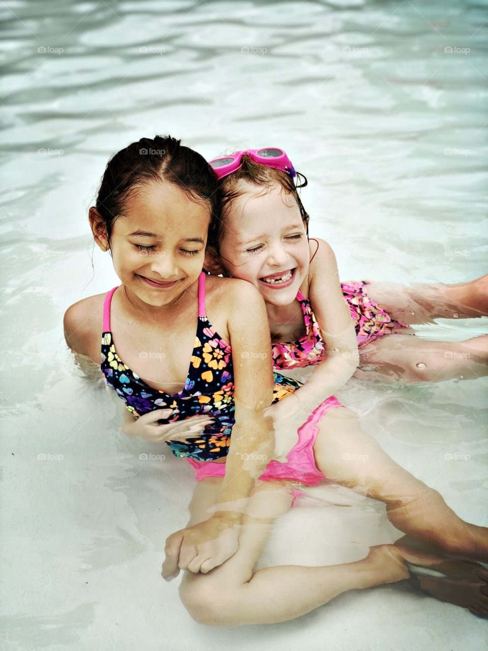 Two girls feeling the joy of summer and friendship. 