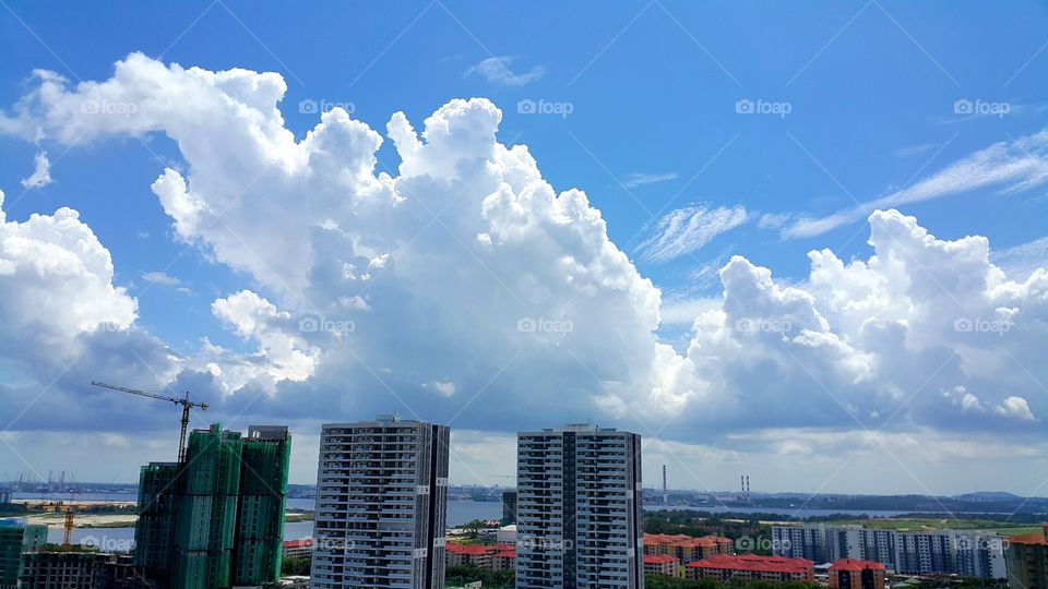 Huge clouds over skyscrapers