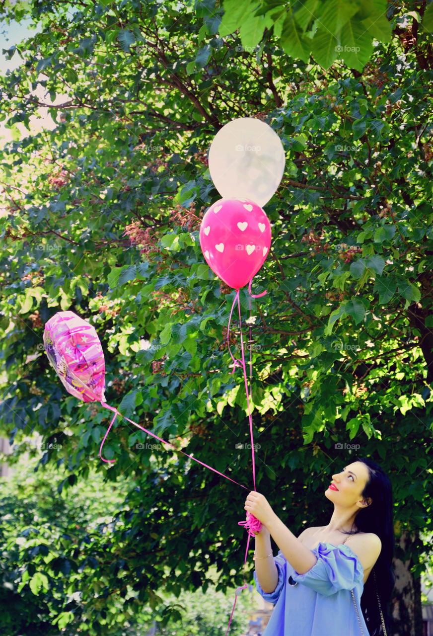 Beautiful girl with ballons
