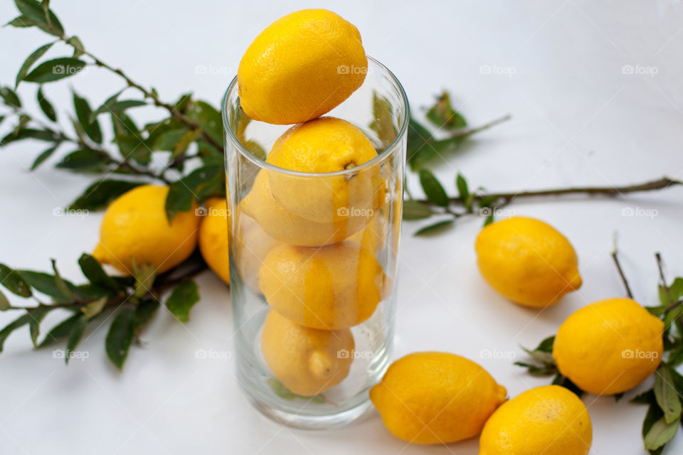 yellow lemons in a vase