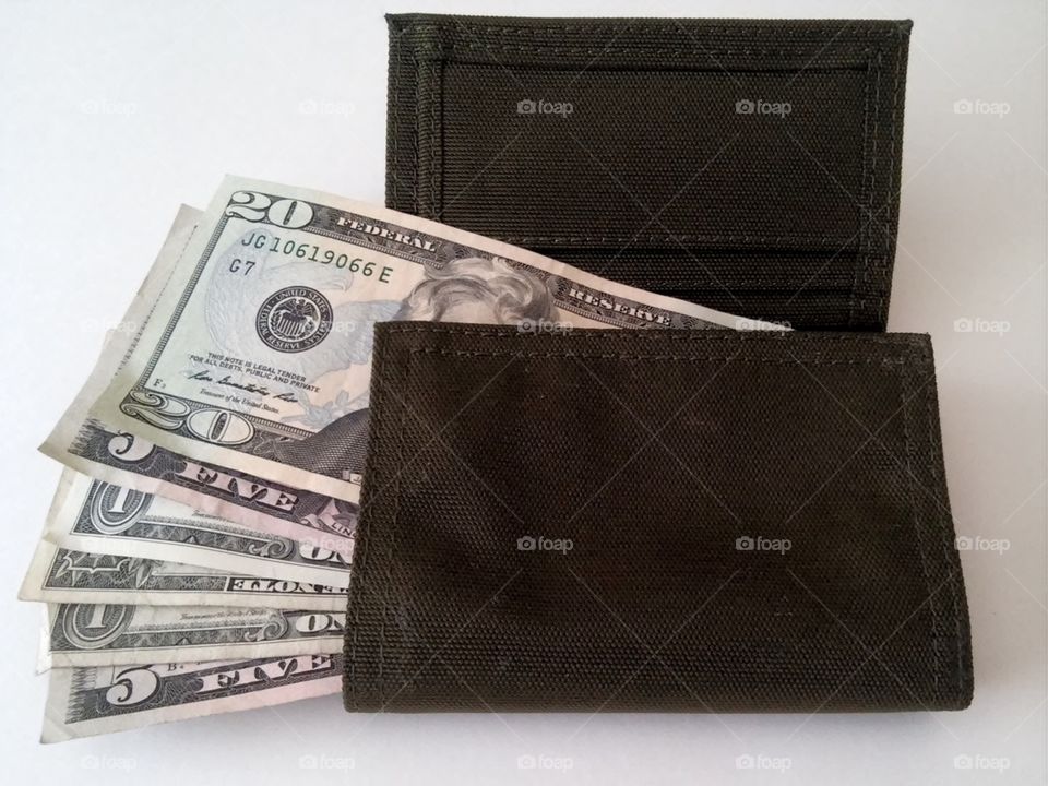 A wallet with dollar bills