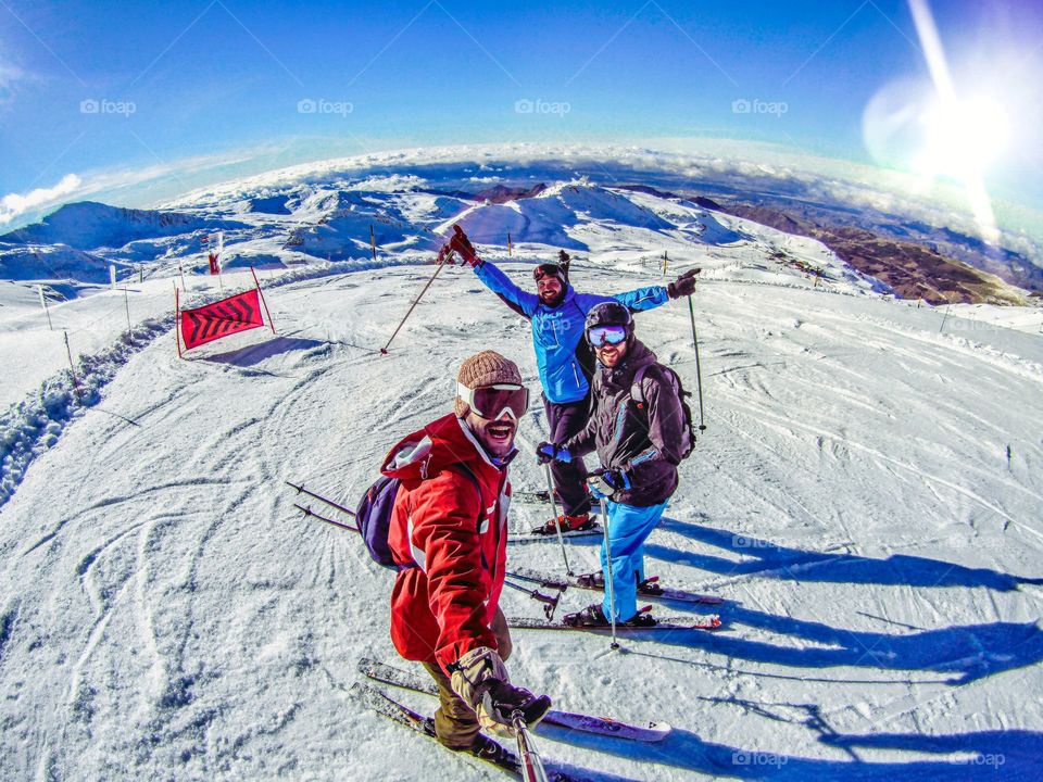 Group of friends skiing in Sierra Nevada, Spain.