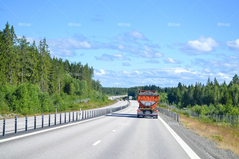 Truck on the road. Delivery, work, working. Transportation. Job. Asphalt. Hard working people. 