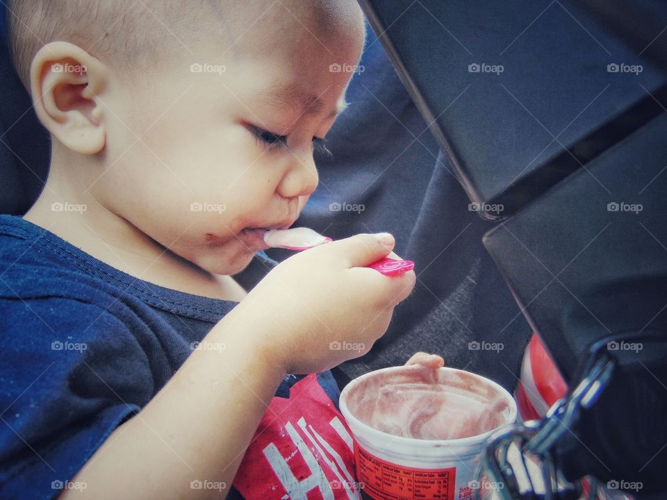 Close-up of a boy eating ice-cream
