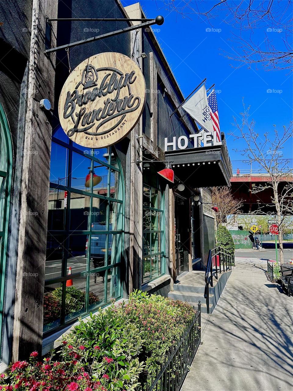 This is the “Brooklyn Lantern”, a pub on the first floor next to the lobby of the “BOX HOUSE HOTEL” on “Box Street” right by the “Pulaski Bridge” in “Greenpoint”, Bklyn visible in the background and “Newtown Creek”. 2024. Hypnotic Productions